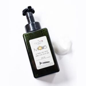 Green bottle of all-natural shaving foam.