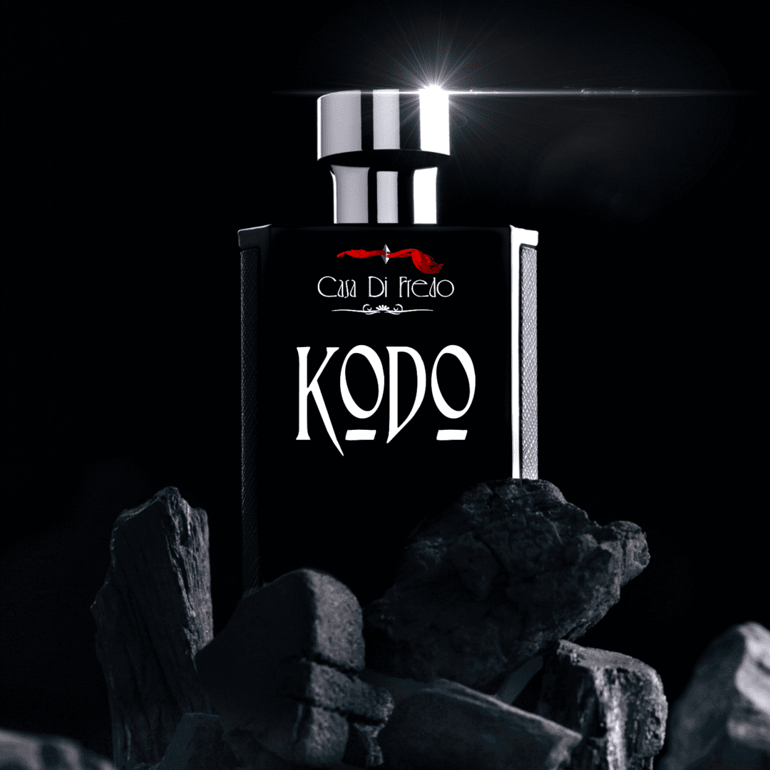 Kodo perfume bottle on black stones.