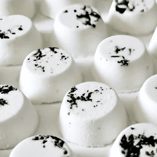 White bath bombs with black flecks.