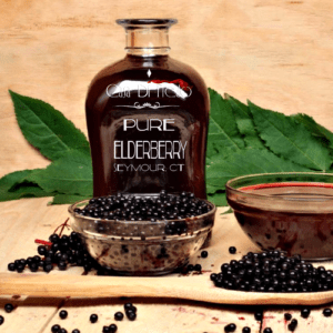 Pure elderberry syrup with berries.