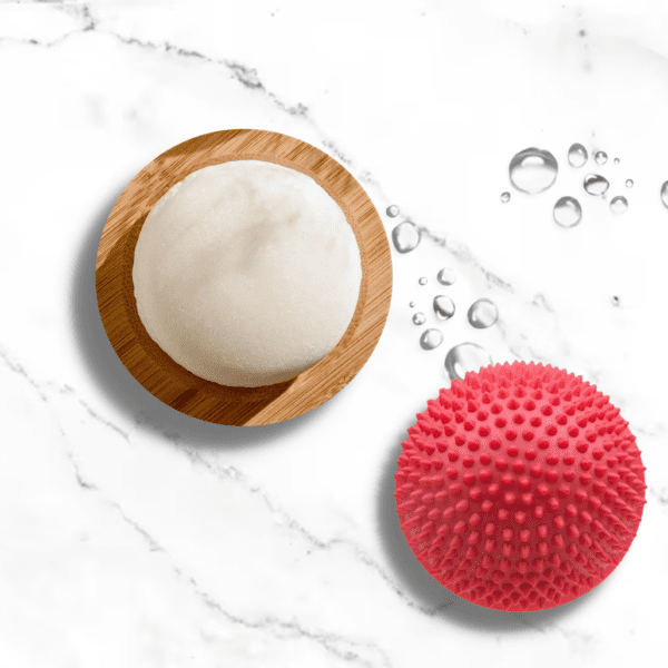 White soap bar and a red spiky ball.