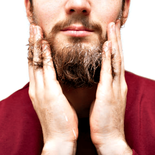 Man applying beard oil with hands.