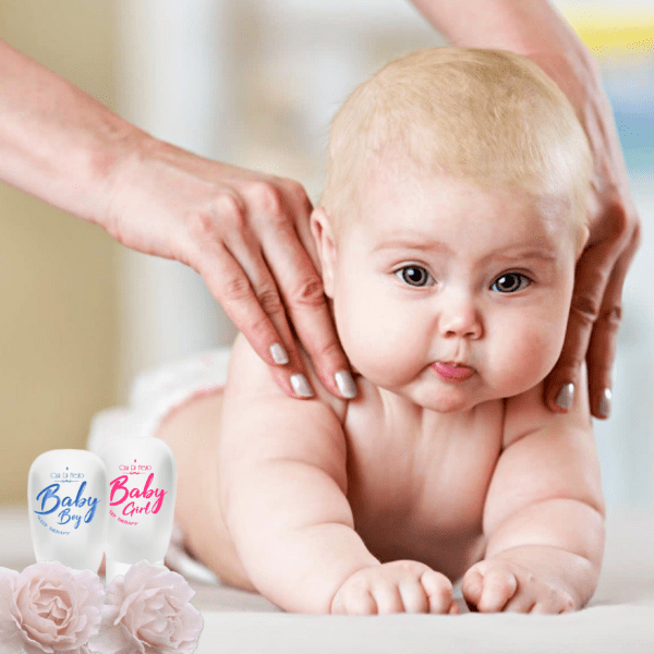 A baby being massaged by a hand.