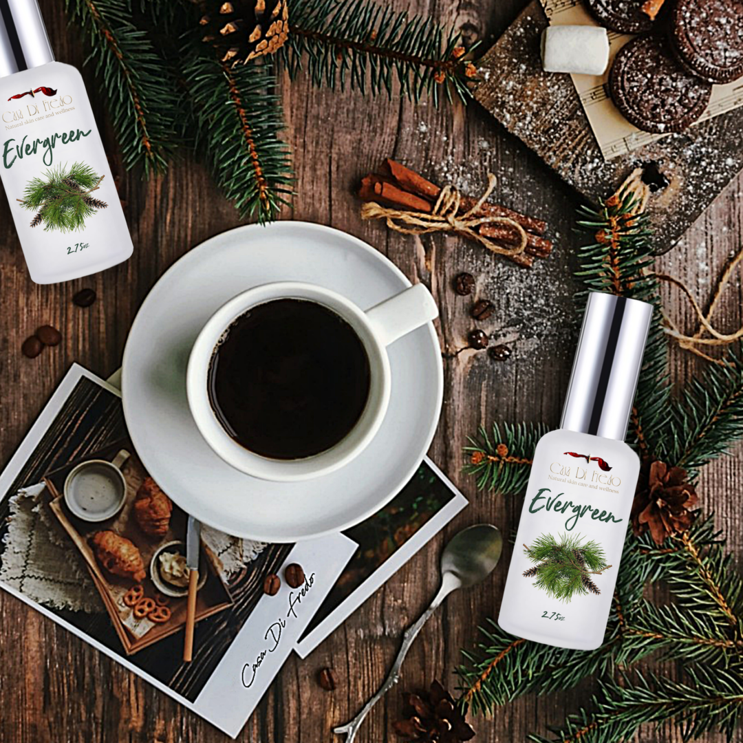 Two Evergreen essential oil bottles on wood table.